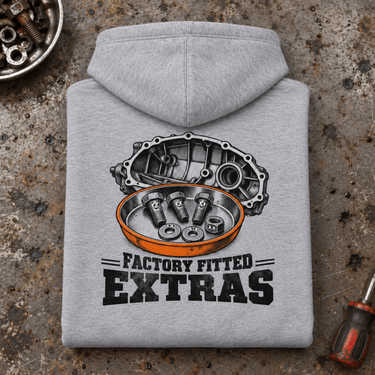 Camberline Gearbox Mechanic Hoodie in heather grey, folded back view on a workshop bench with full graphic visible