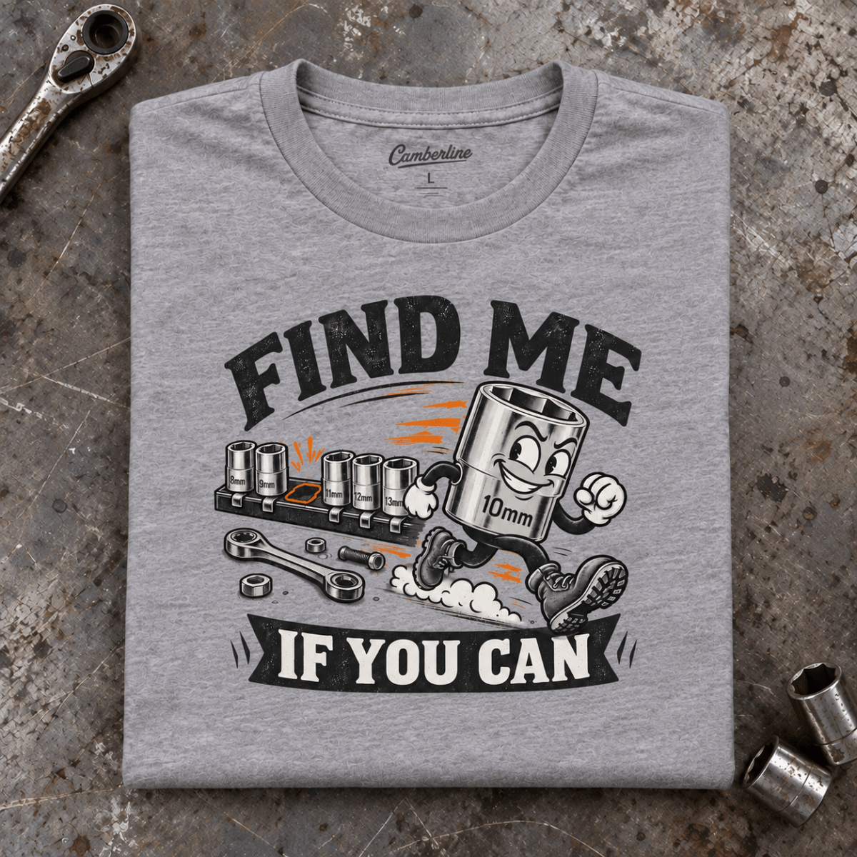 Camberline 10mm Socket Mechanic T-Shirt in heather grey, folded front view on a workshop bench with full graphic visible