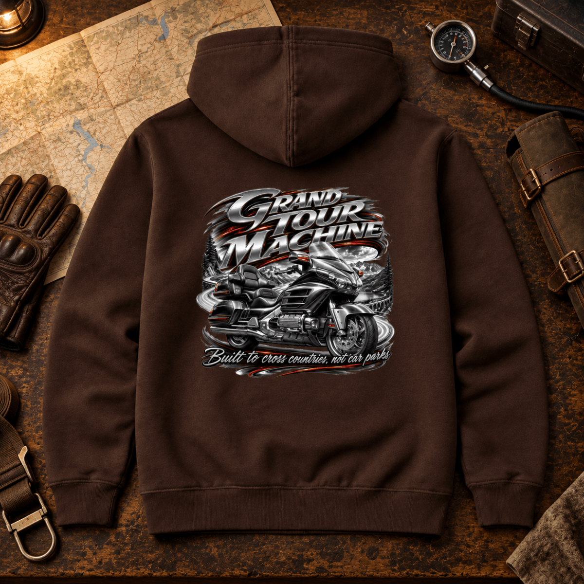 Grand Tour Machine touring motorcycle brown hoodie back hero in a travel workshop