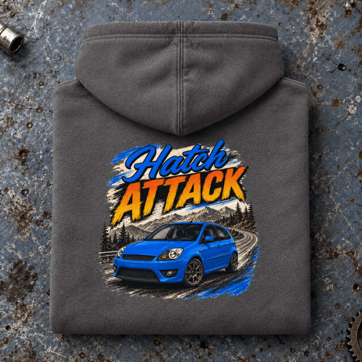 Hot Hatch Graphic Hoodie – Hatch Attack Modern Performance, folded back main hero on a worn automotive workbench – car-hd-0014