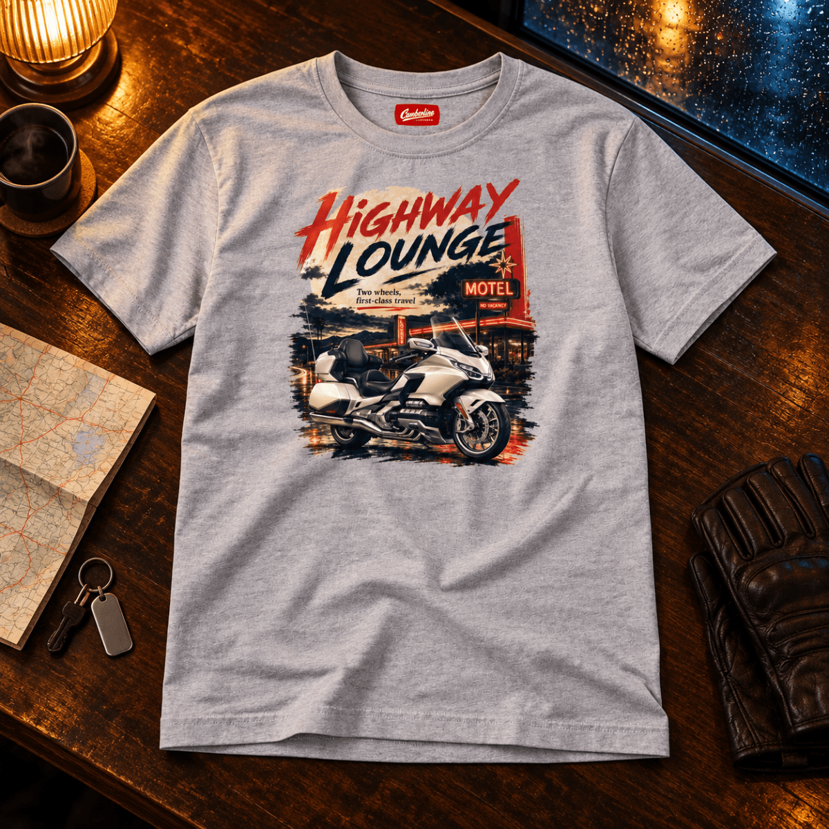 Highway Lounge touring motorcycle grey T-shirt front hero in a rainy road-stop setting