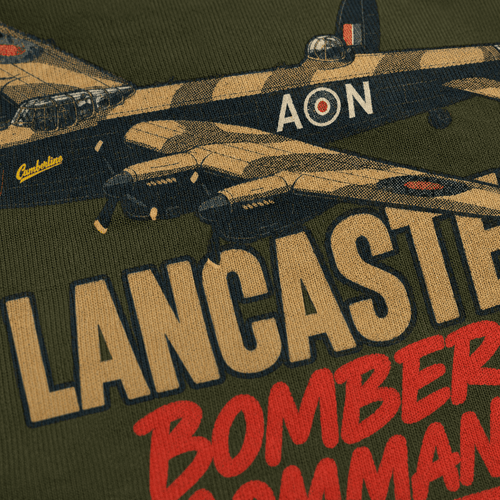 Close-up of a graphic print on an olive green garment featuring a vintage Lancaster bomber in camouflage with large tan and red text reading 'LANCASTER' and 'BOMBER COMMAND'.