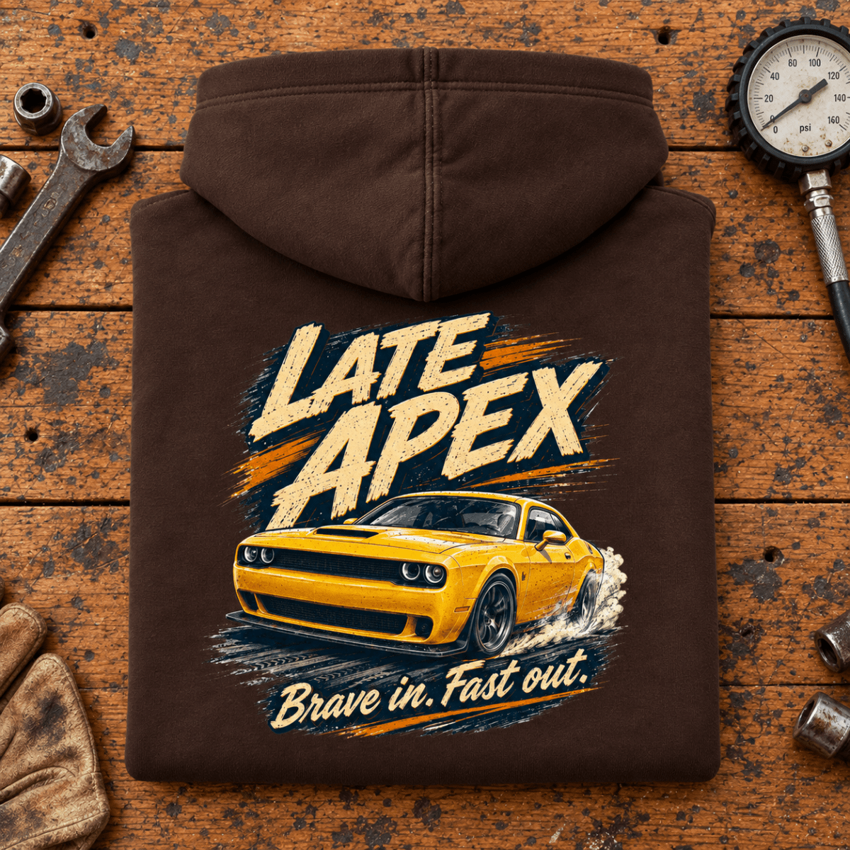 Folded hot chocolate Late Apex Track Day Motorsport hoodie back on a workshop bench — car-hd-0088