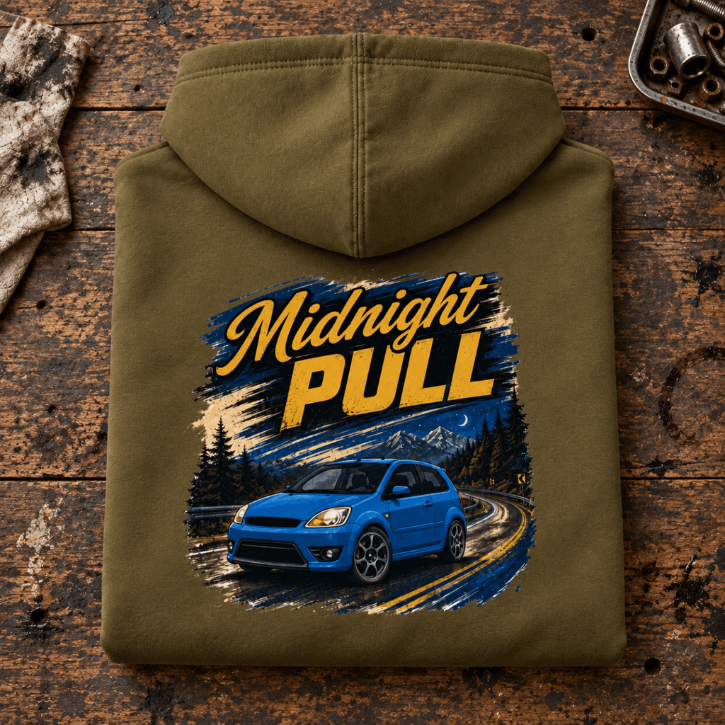 Hot Hatch Graphic Hoodie – Midnight Pull Night Drive, folded back main hero on a worn automotive workbench – car-hd-0019