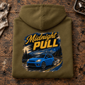 Hot Hatch Graphic Hoodie – Midnight Pull Night Drive, folded back main hero on a worn automotive workbench – car-hd-0019