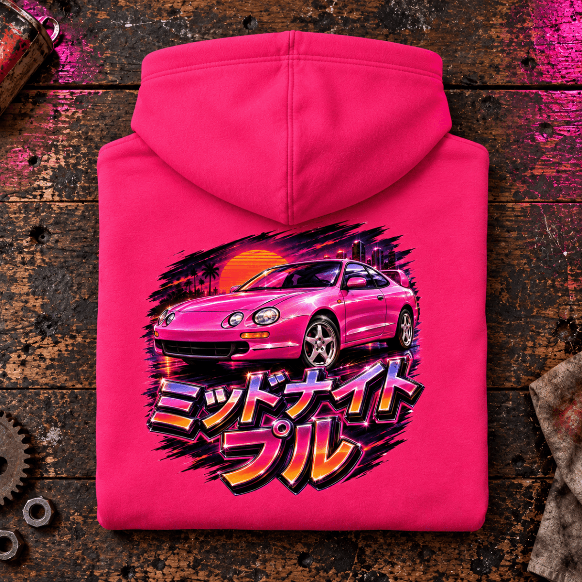 JDM Car Graphic Hoodie – Midnight Pull Sports Car Night Drive, folded back main hero on a worn automotive workbench – car-hd-0021