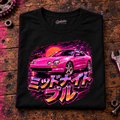 JDM Car Graphic T-Shirt – Midnight Pull Sports Car Night Drive, folded front main hero on a worn automotive workbench – car-ts-0021