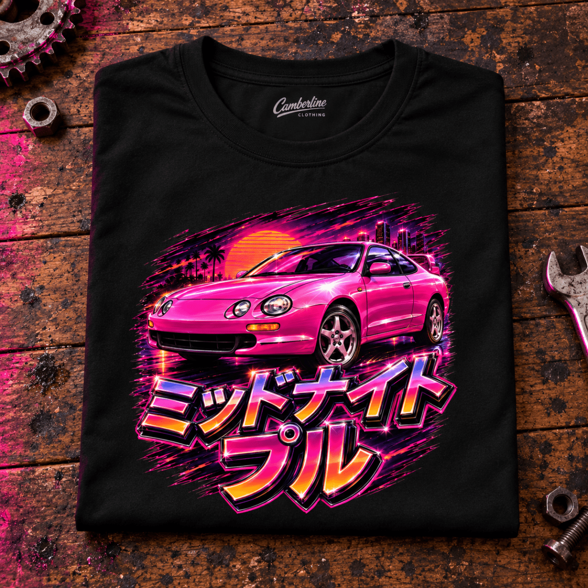 JDM Car Graphic T-Shirt – Midnight Pull Sports Car Night Drive, folded front main hero on a worn automotive workbench – car-ts-0021