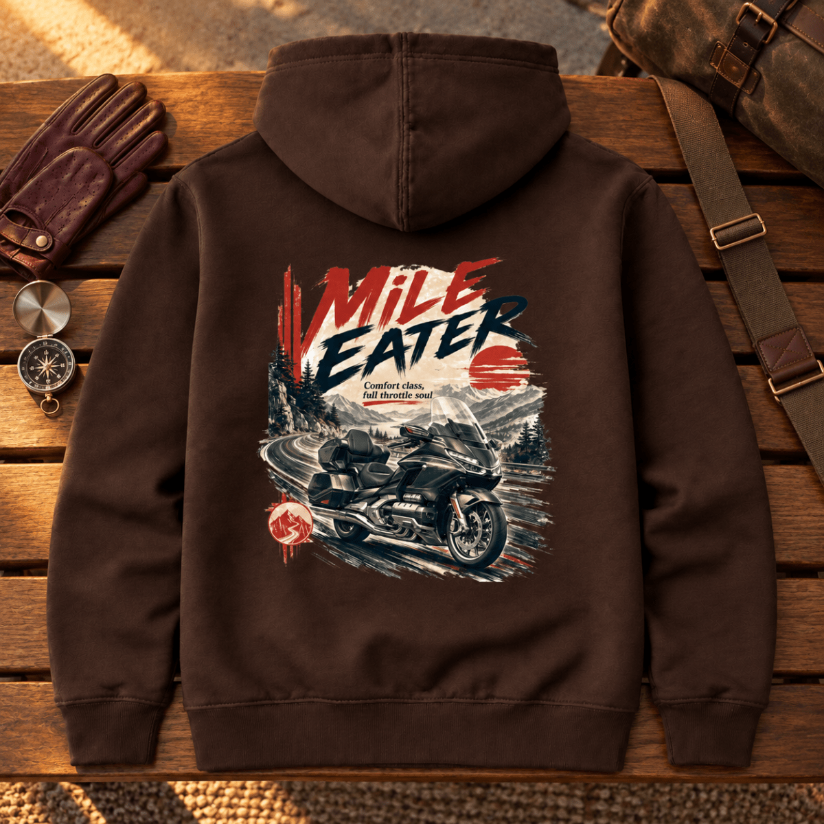 Mile Eater luxury touring motorcycle brown hoodie back hero on a premium travel bench