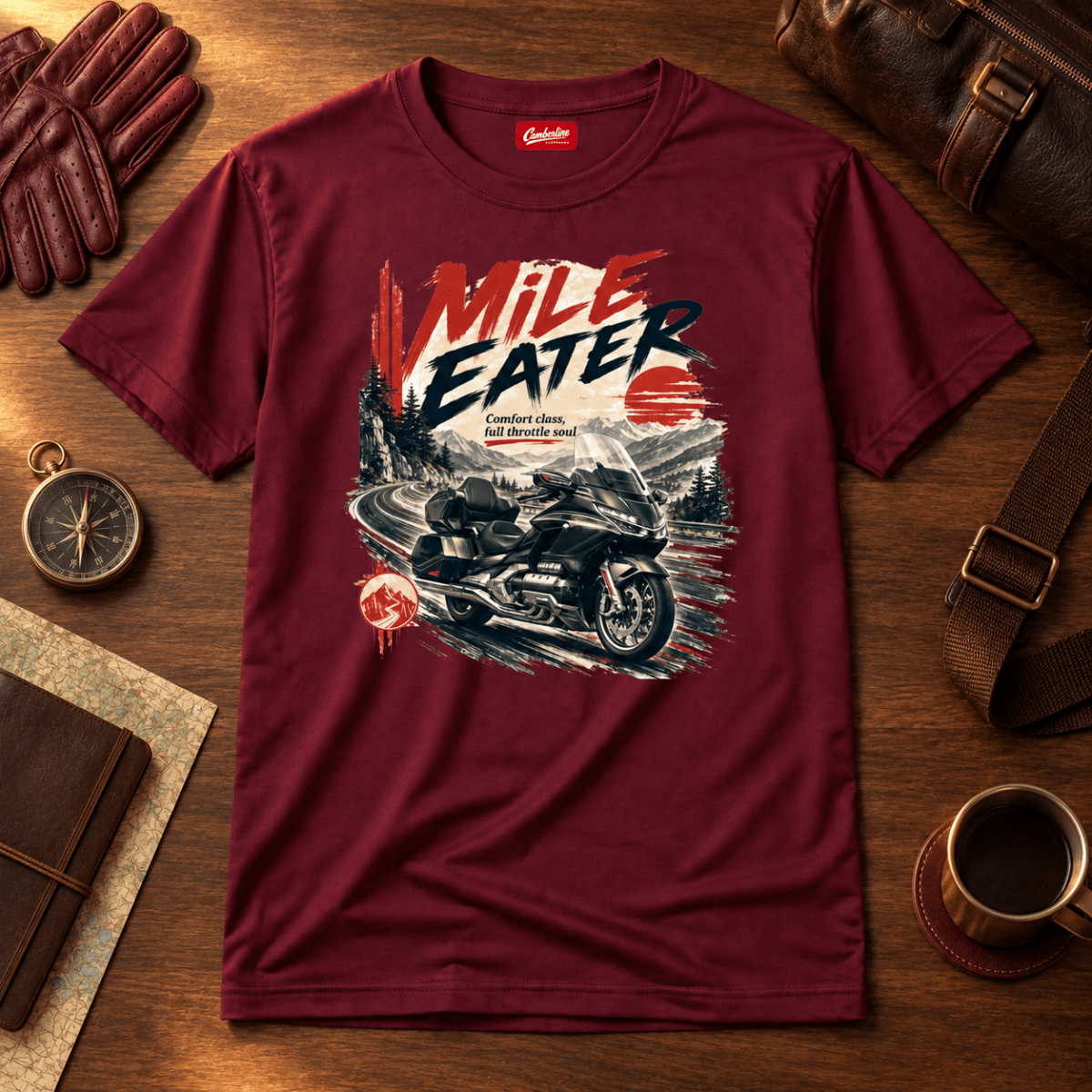 Mile Eater luxury touring motorcycle burgundy T-shirt front hero on a premium travel bench