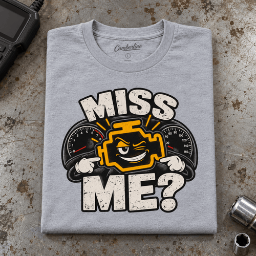 Camberline Check Engine Mechanic T-Shirt in heather grey, folded front view on a workshop bench with full graphic visible