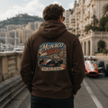 Model wearing Camberline Cars Monaco Hero Hoodie in Hot Chocolate
