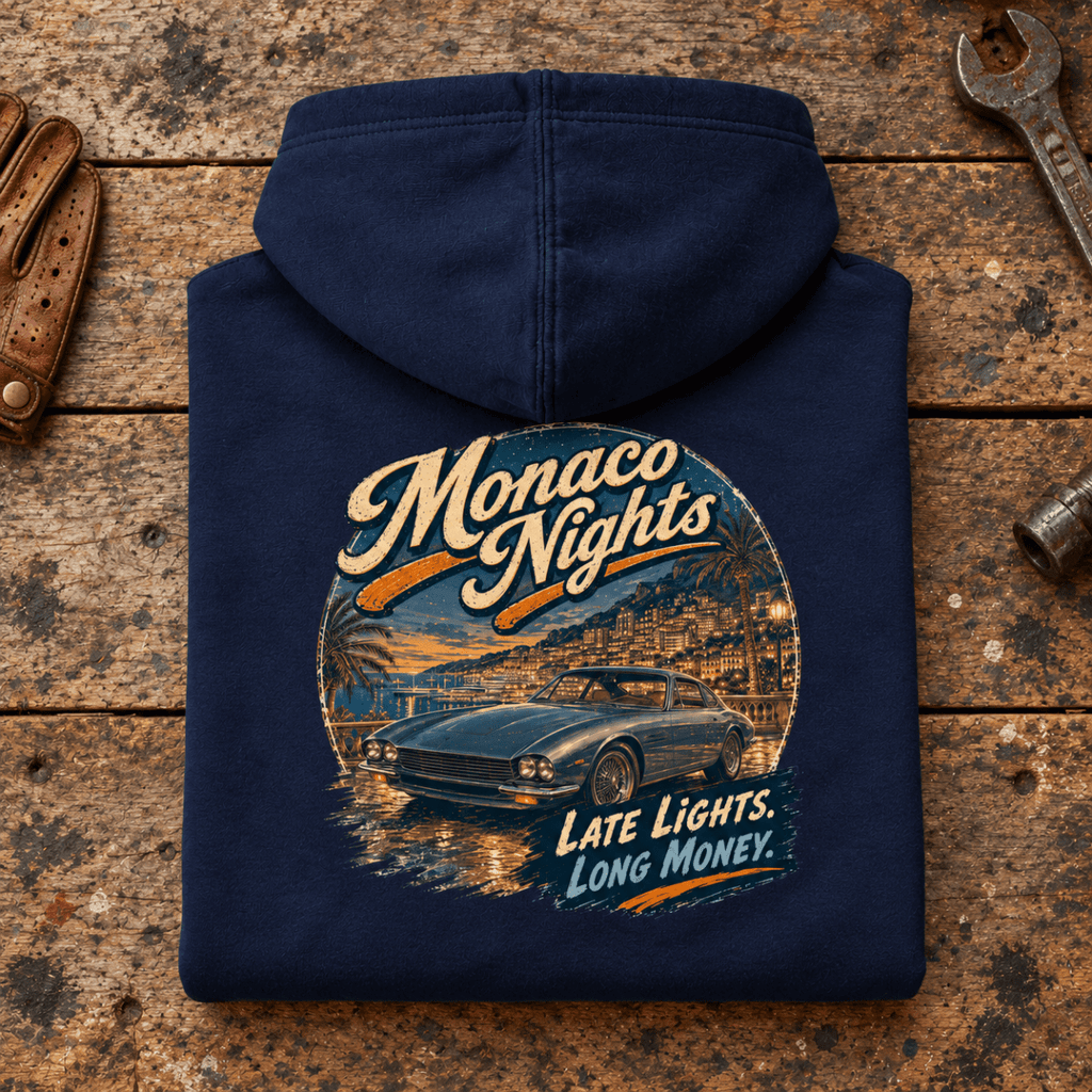 Classic Coupe Graphic Hoodie – Monaco Nights, folded back main hero on a worn automotive workbench – car-hd-0054