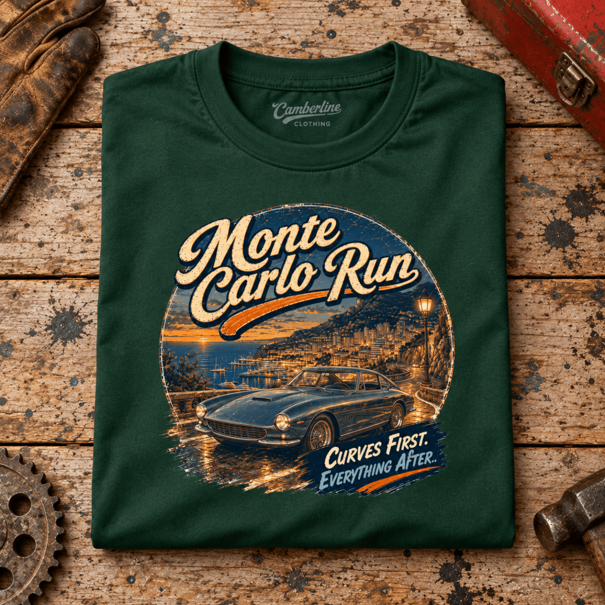 Classic Coupe Graphic T-Shirt – Monte Carlo Run, folded front main hero on a worn automotive workbench – car-ts-0053