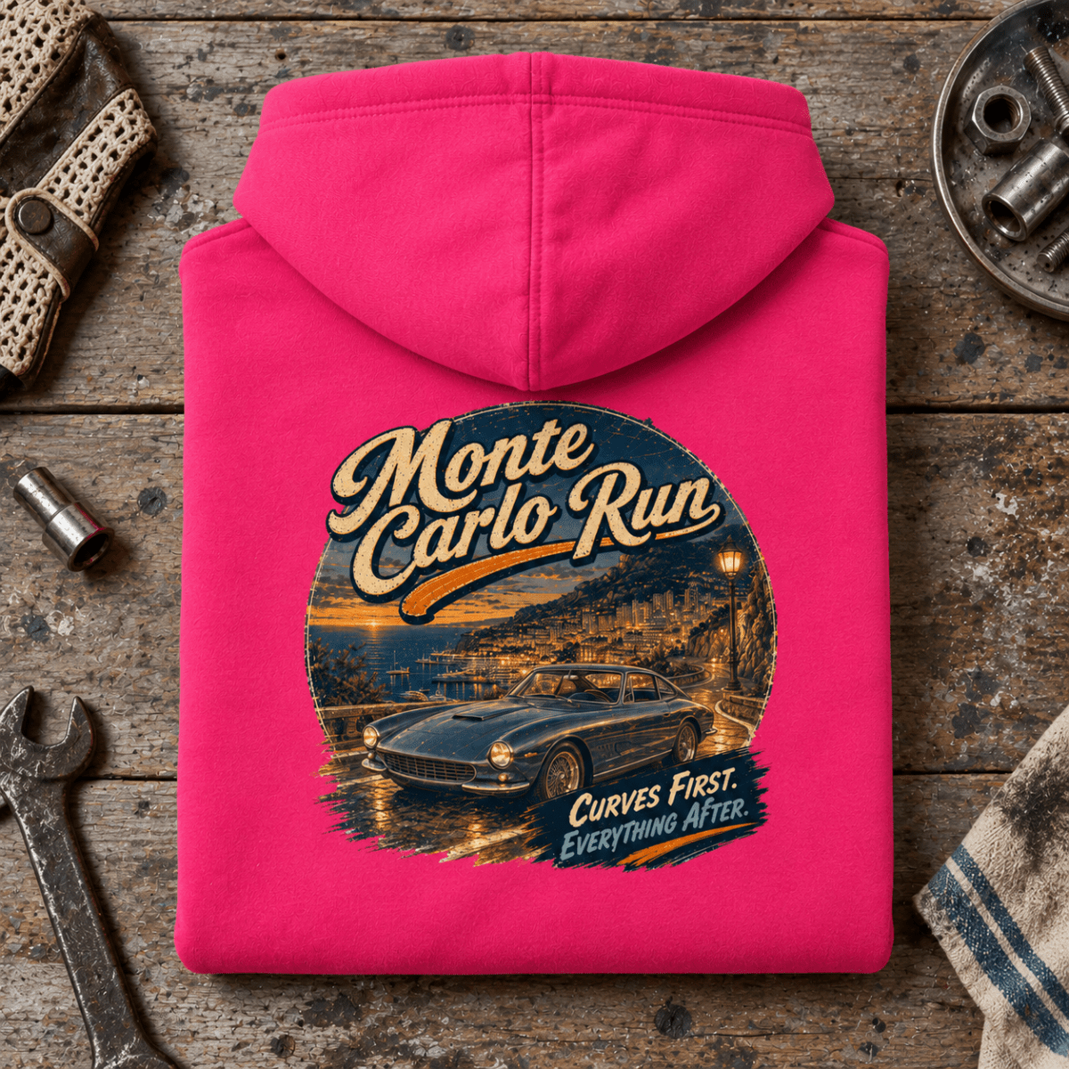 Classic Coupe Graphic Hoodie – Monte Carlo Run, folded back hero on a worn automotive workbench – car-hd-0053