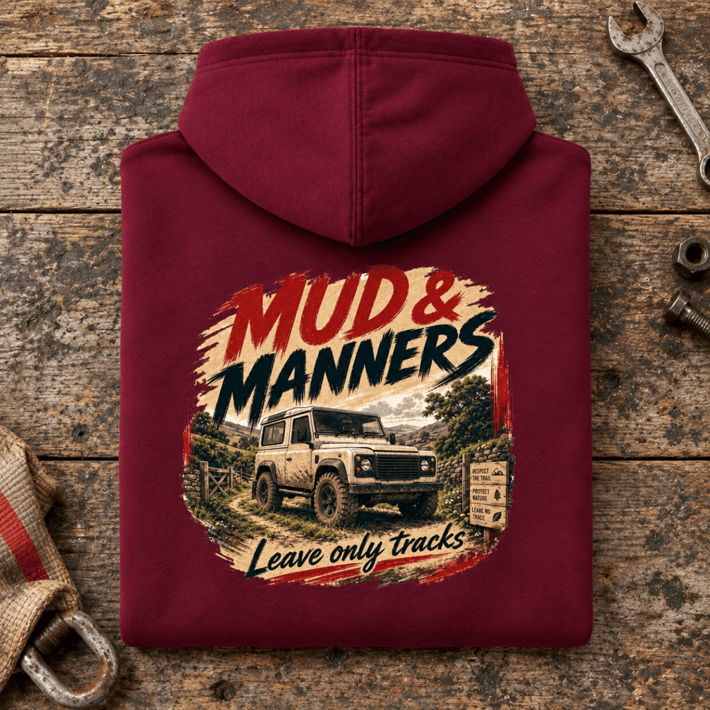 Camberline mud and manners 4x4 burgundy hoodie, folded rear view on a workshop bench with the complete graphic visible.