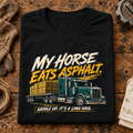 Black My Horse Eats Asphalt lorry T-shirt folded on a farm-haulage workbench