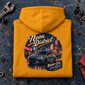 Hot Hatch Graphic Hoodie – Neon District Modern Hatchback, folded back main hero on a worn automotive workbench – car-hd-0058