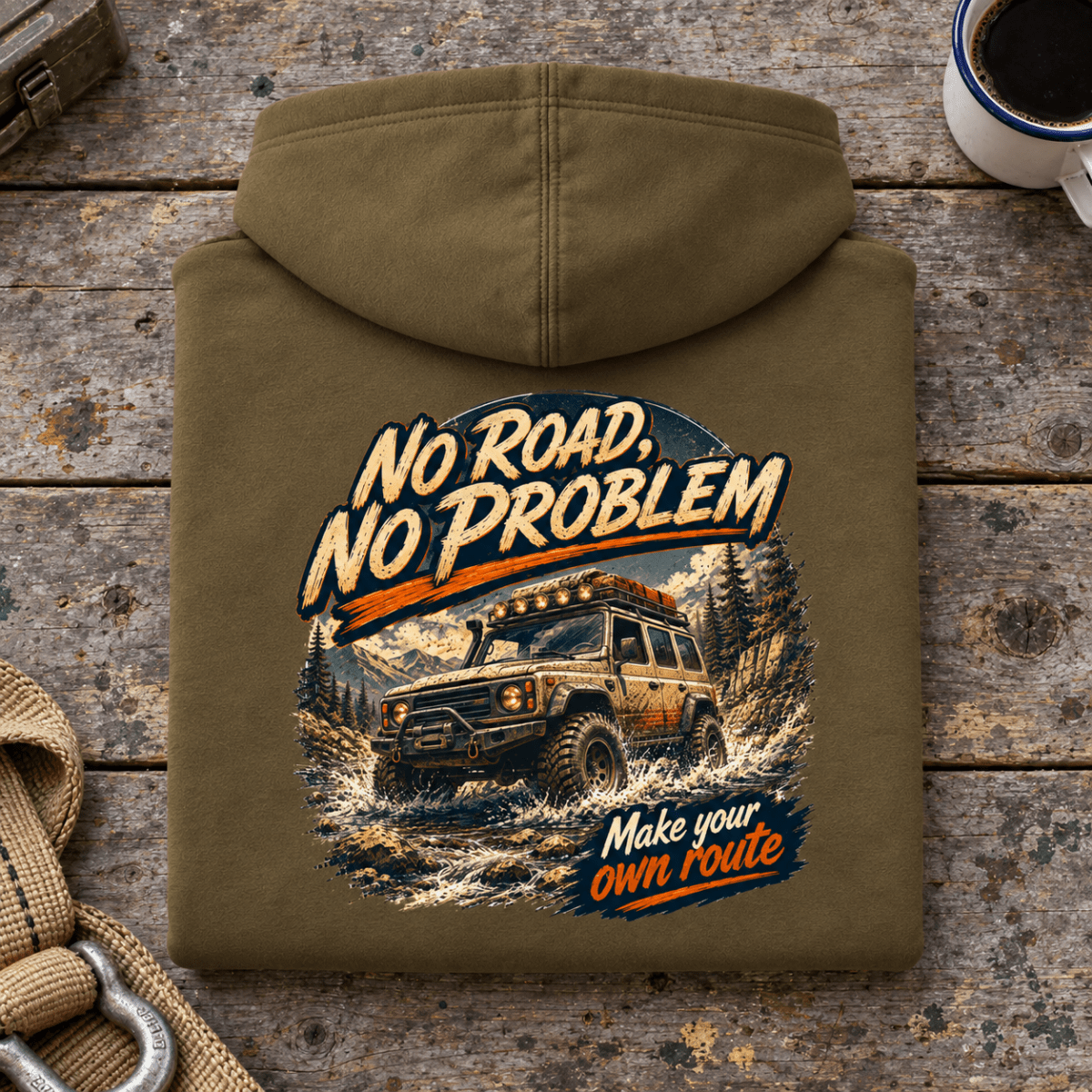 Folded combat green No Road No Problem Adventure hoodie back on a workshop bench — car-hd-0090