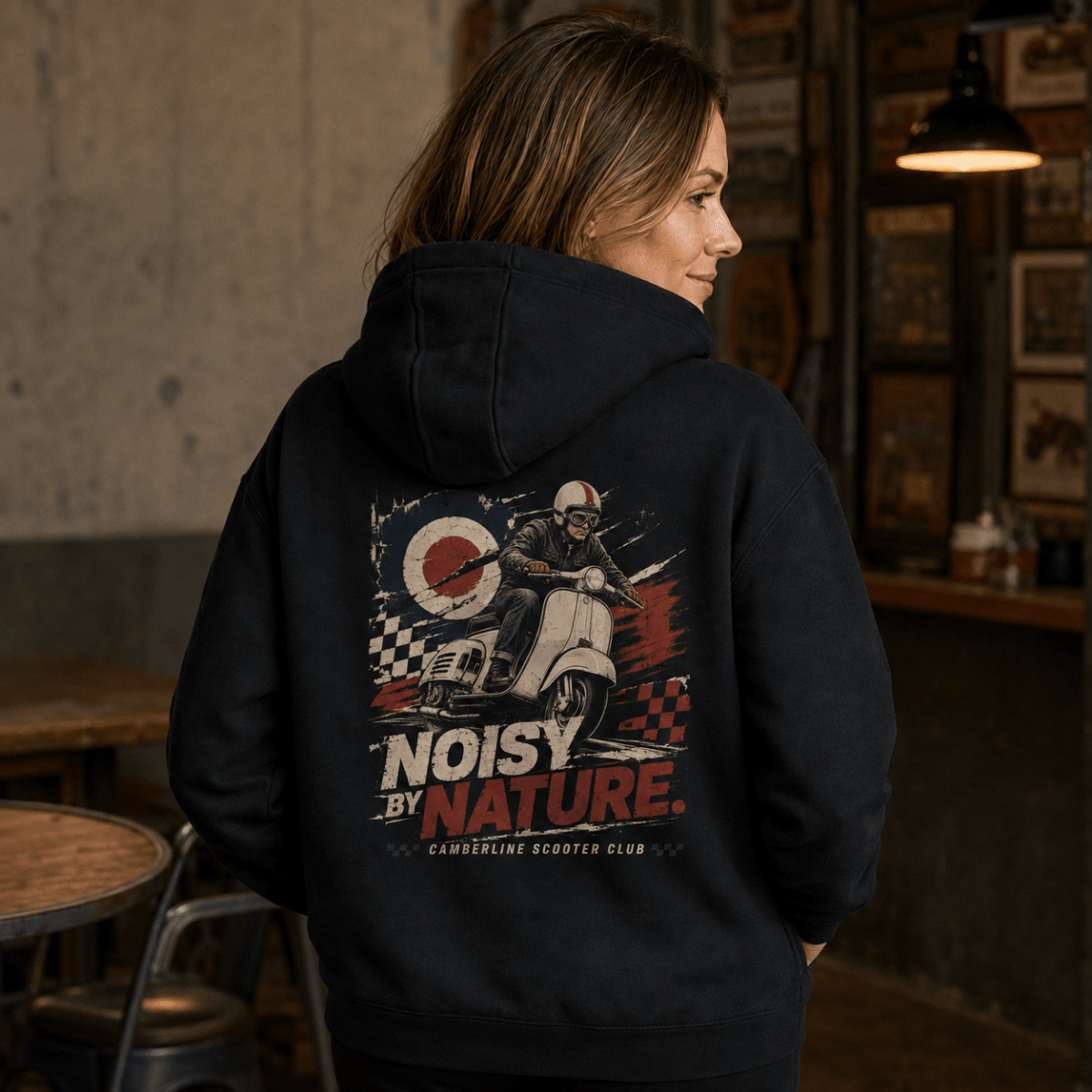 Model wearing a black Noisy by Nature vintage scooter graphic hoodie, back print view