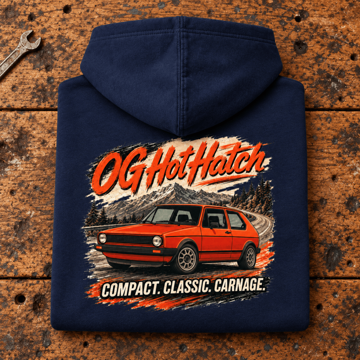 Hot Hatch Graphic Hoodie – OG Classic Pioneer Performance, folded back main hero on a worn automotive workbench – car-hd-0011