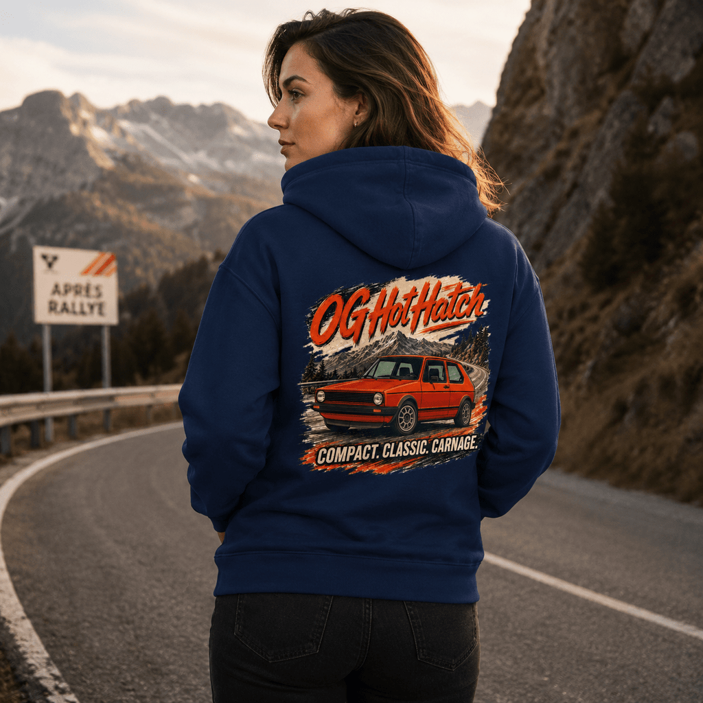 Model wearing the Camberline Cars OG Hot Hatch Classic Hoodie – Navy, showing the automotive graphic in a car culture setting