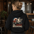 Model wearing a black Oil Smoke Weekend vintage scooter graphic hoodie, back print view