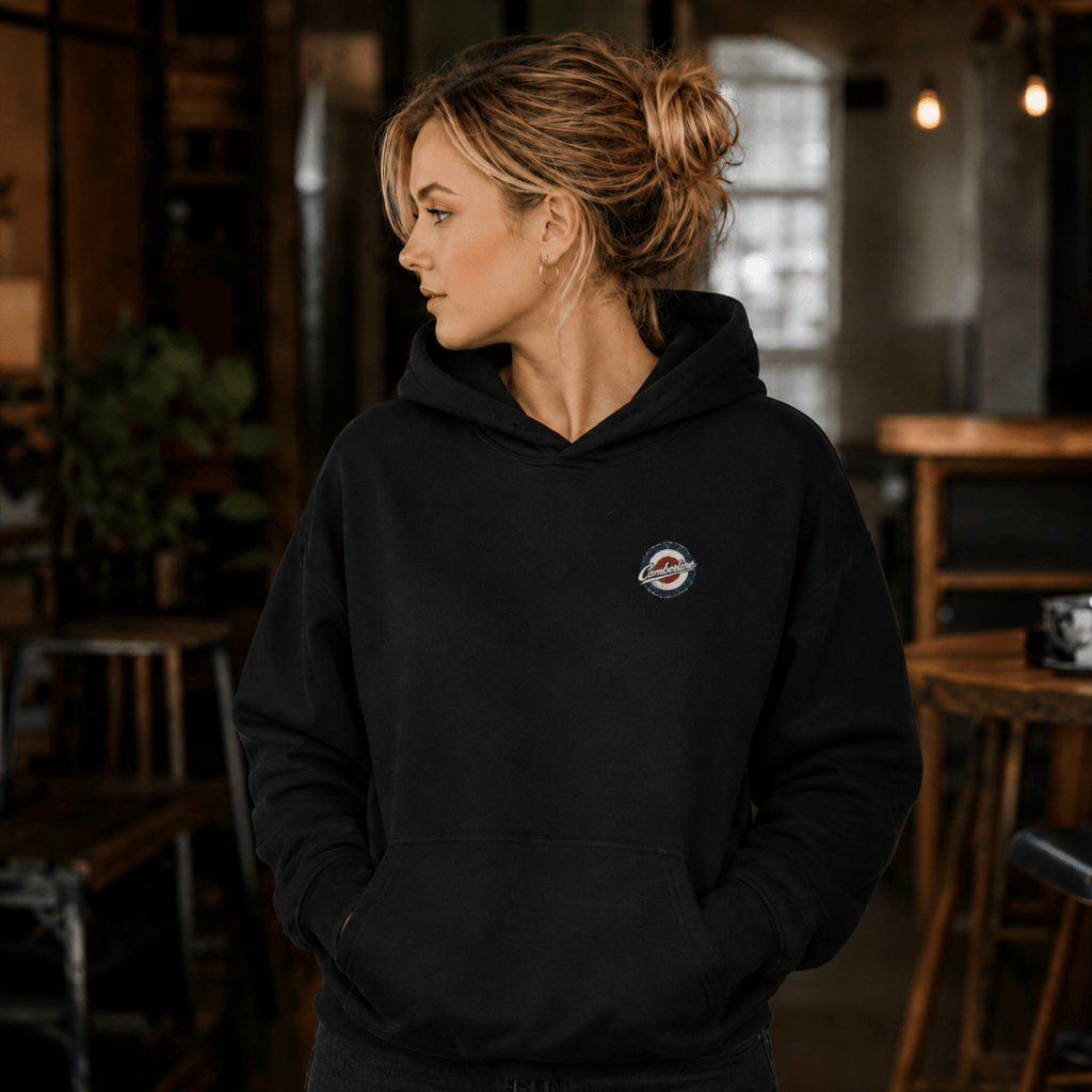 Front view of model wearing the black Camberline hoodie with left-chest print