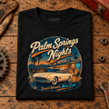 Classic Roadster Graphic T-Shirt – Palm Springs Nights Classic Desert Drive, folded front main hero on a worn automotive workbench – car-ts-0060