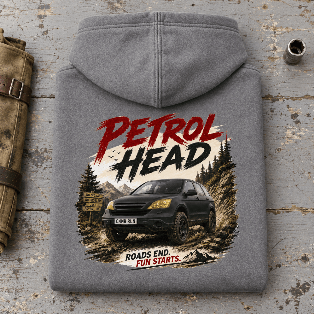 Folded shark grey Petrol Head Black SUV hoodie back on a workshop bench — car-hd-0010