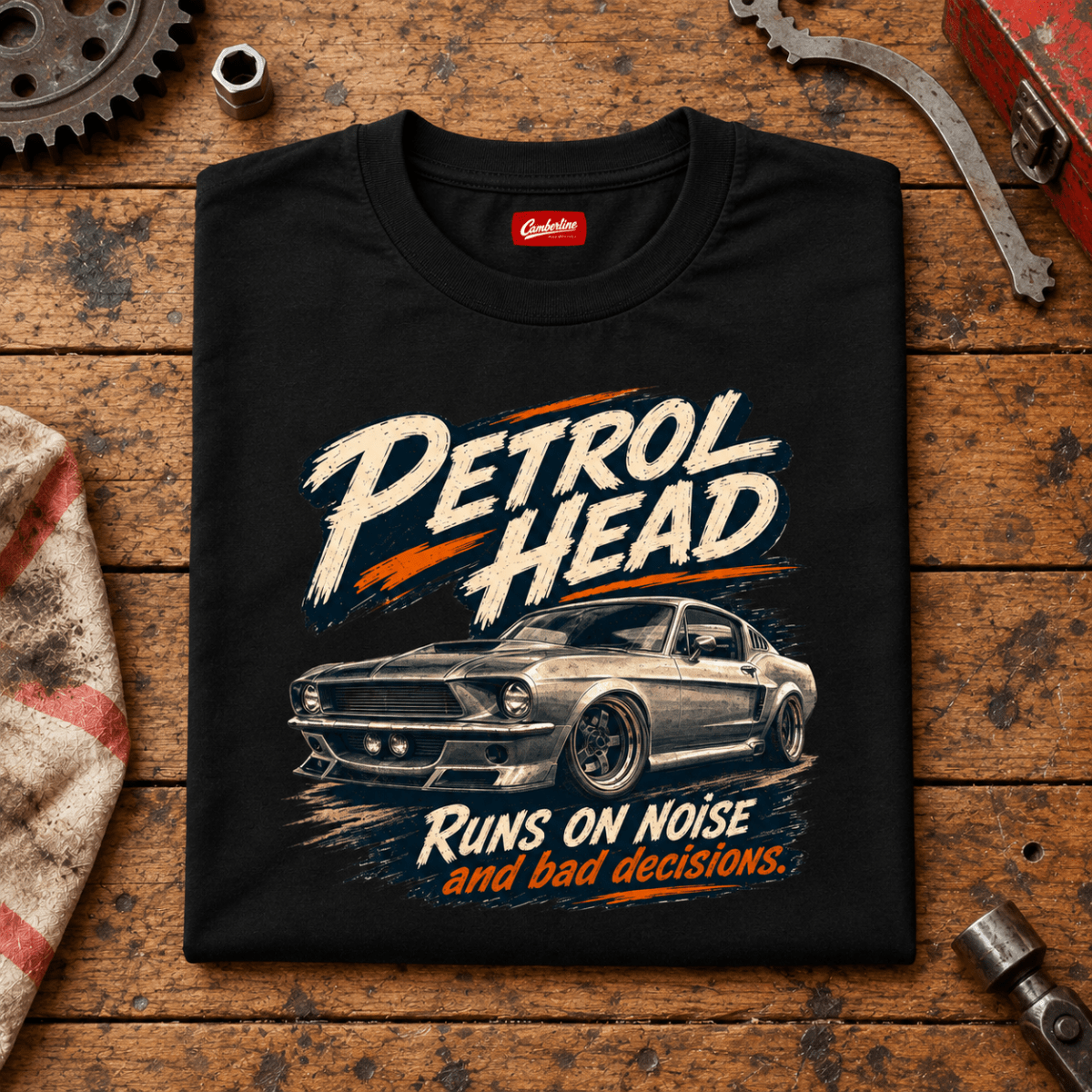 Muscle Car Graphic T-Shirt – Classic V8, folded front hero on a worn automotive workbench – car-ts-0080