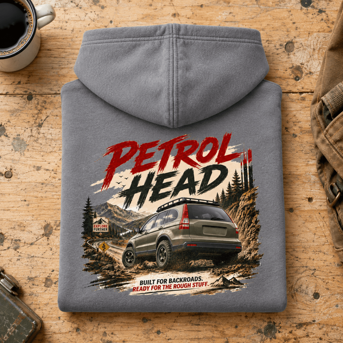 Folded shark grey Petrol Head Green SUV hoodie back on a workshop bench — car-hd-0009
