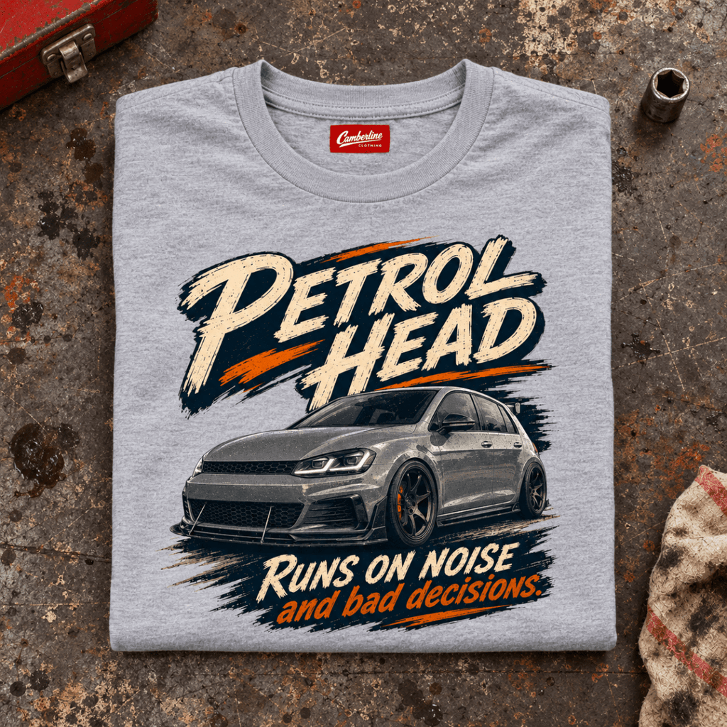 Hot Hatch Graphic T-Shirt – Performance Car Enthusiast, folded front main hero on a worn automotive workbench – car-ts-0083