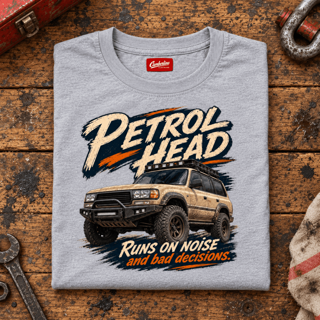 4x4 Off Road Graphic T-Shirt – Petrol Head, folded front hero on a worn automotive workbench – car-ts-0078