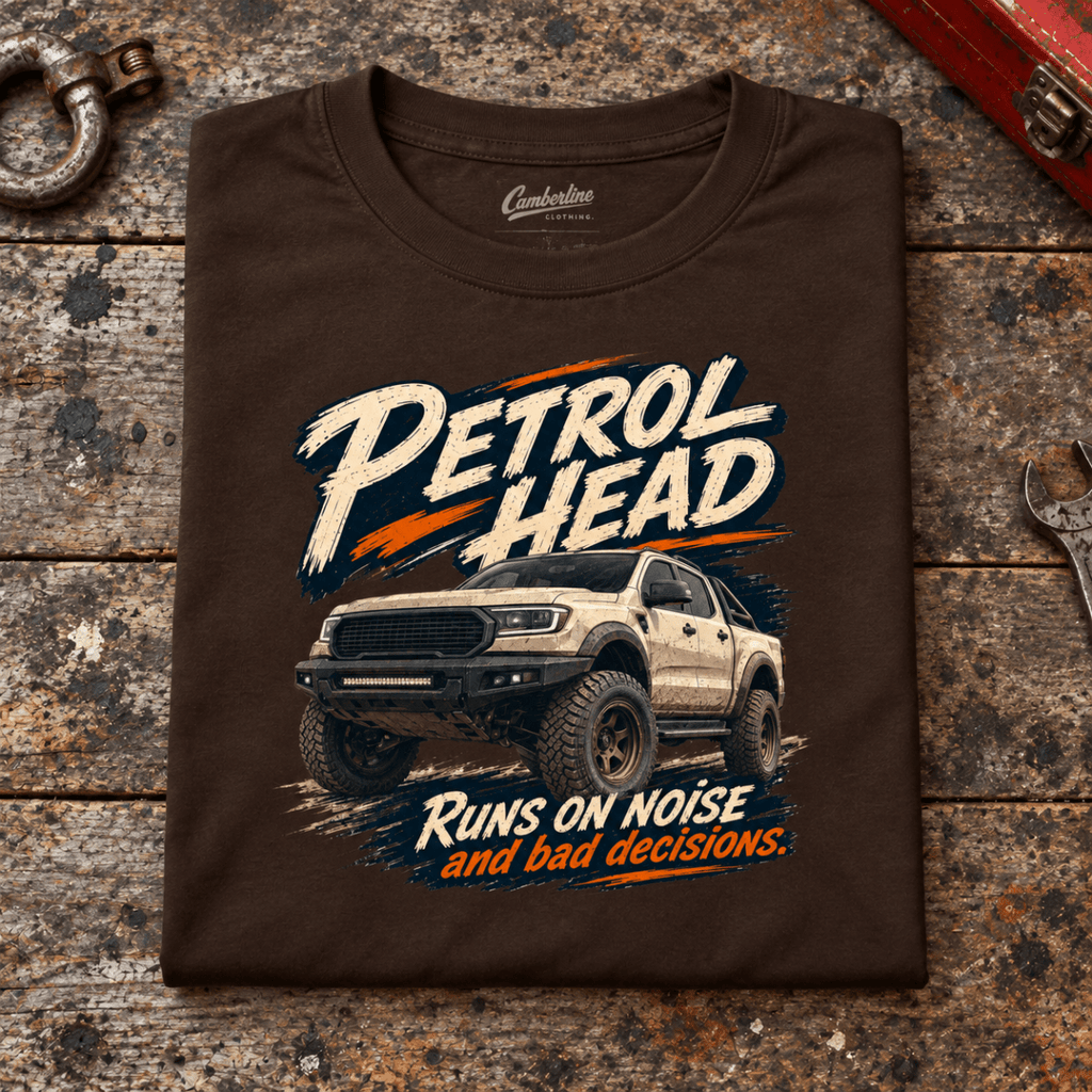4x4 Off Road Graphic T-Shirt – Pickup Truck, folded front main hero on a worn automotive workbench – car-ts-0081