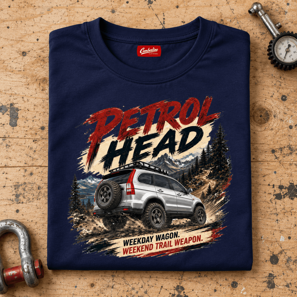 Folded navy Petrol Head Silver SUV T-shirt front on a workshop bench — car-ts-0008