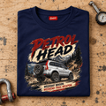 Folded navy Petrol Head Silver SUV T-shirt front on a workshop bench — car-ts-0008