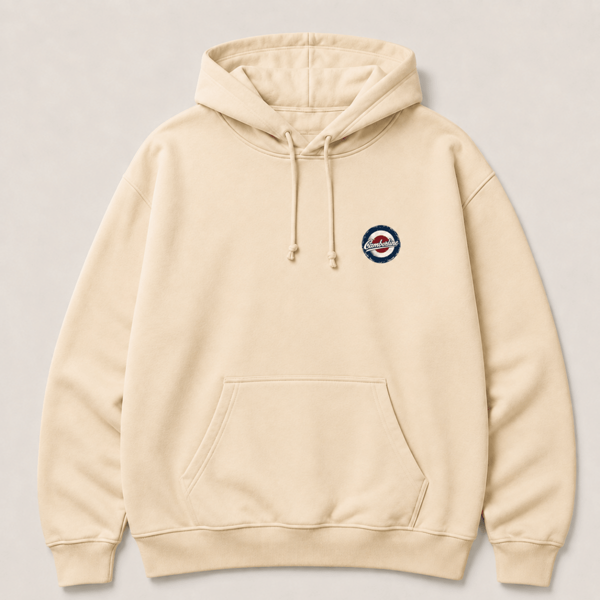 Front product view of the cream hoodie with small Camberline left-chest print