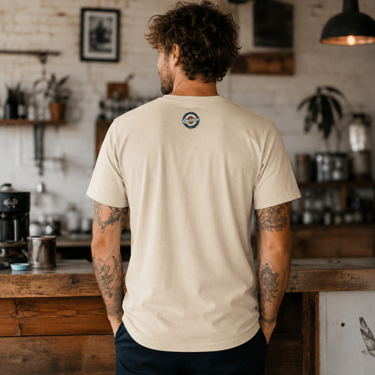 Back view of model wearing the cream Camberline T-shirt with nape print