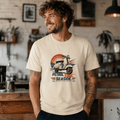 Model wearing a cream Petrol Soul Seaside vintage scooter graphic T-shirt, front view