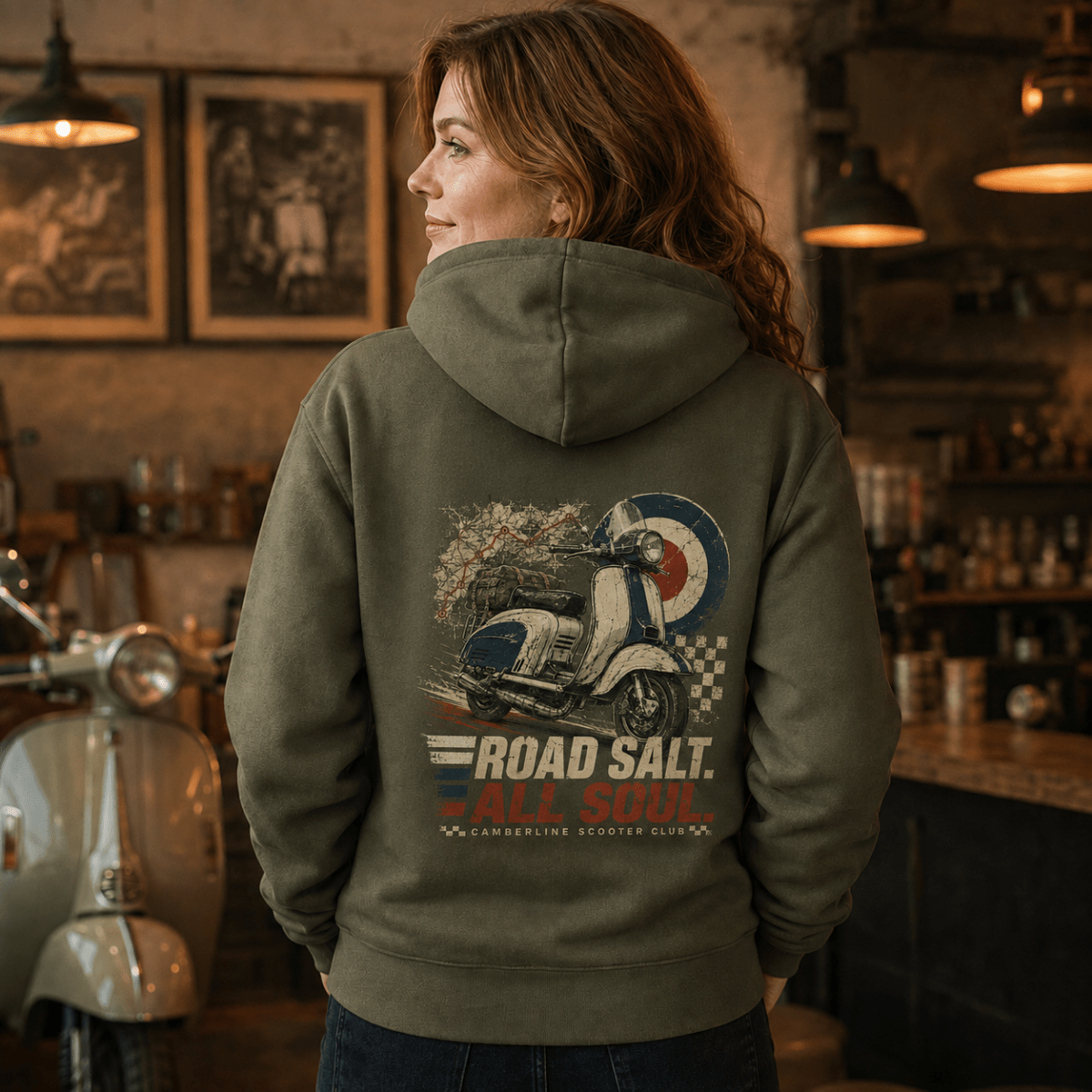 Model wearing a military green Road Salt All Soul vintage scooter graphic hoodie, back print view