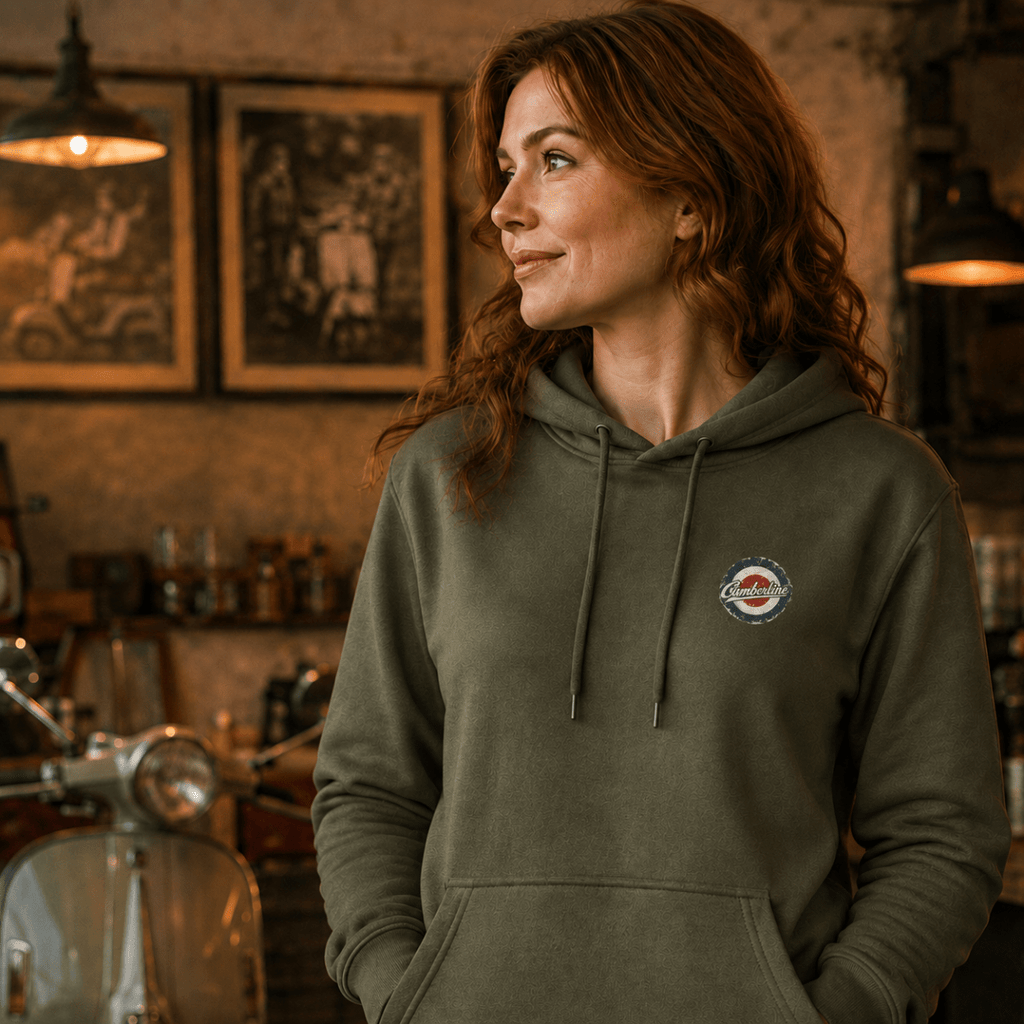 Front view of model wearing the military green Camberline hoodie with left-chest print