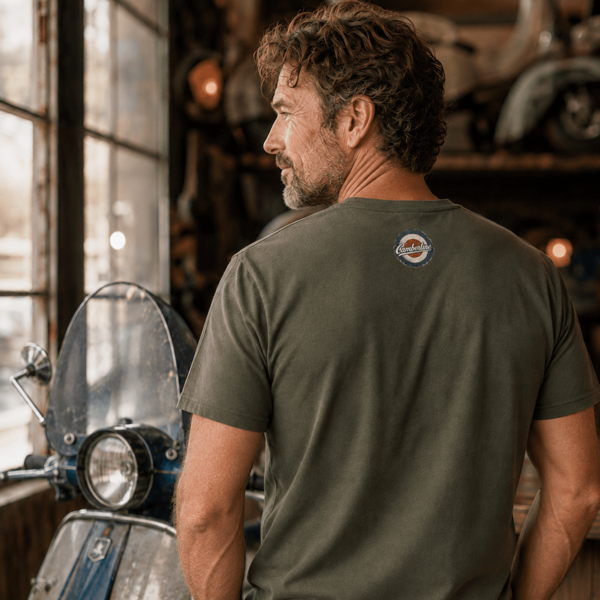 Back view of model wearing the military green Camberline T-shirt with nape print