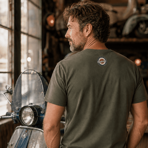 Back view of model wearing the military green Camberline T-shirt with nape print