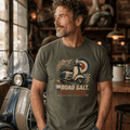 Model wearing a military green Road Salt All Soul vintage scooter graphic T-shirt, front view