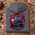 Classic Roadster Graphic Hoodie – Riot Coastal Nights Top Down, folded back main hero on a worn automotive workbench – car-hd-0047
