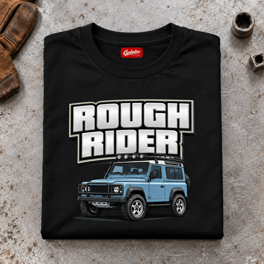 Folded black Rough Rider T-shirt front on a workshop bench — car-ts-0001