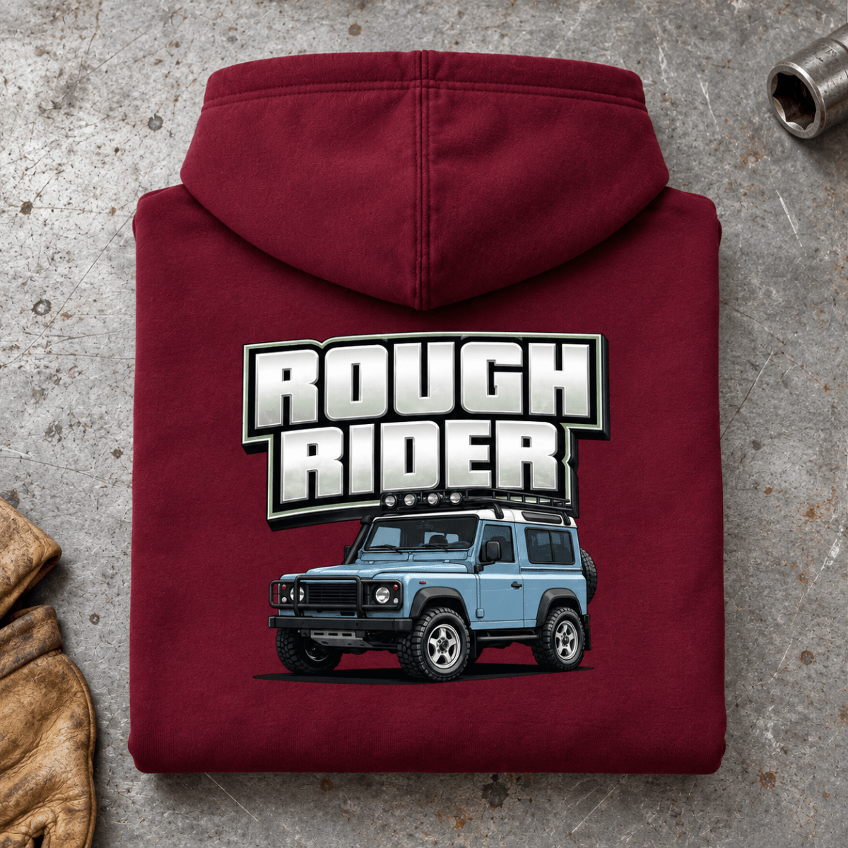 Folded burgundy Rough Rider hoodie back on a workshop bench — car-hd-0001