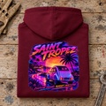 Camberline Classic French Car Graphic Hoodie in burgundy, folded back view on a workshop bench with the full graphic visible