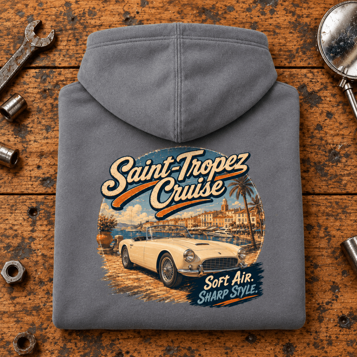 Classic Roadster Graphic Hoodie – Saint Tropez Cruise Classic Riviera, folded back main hero on a worn automotive workbench – car-hd-0051